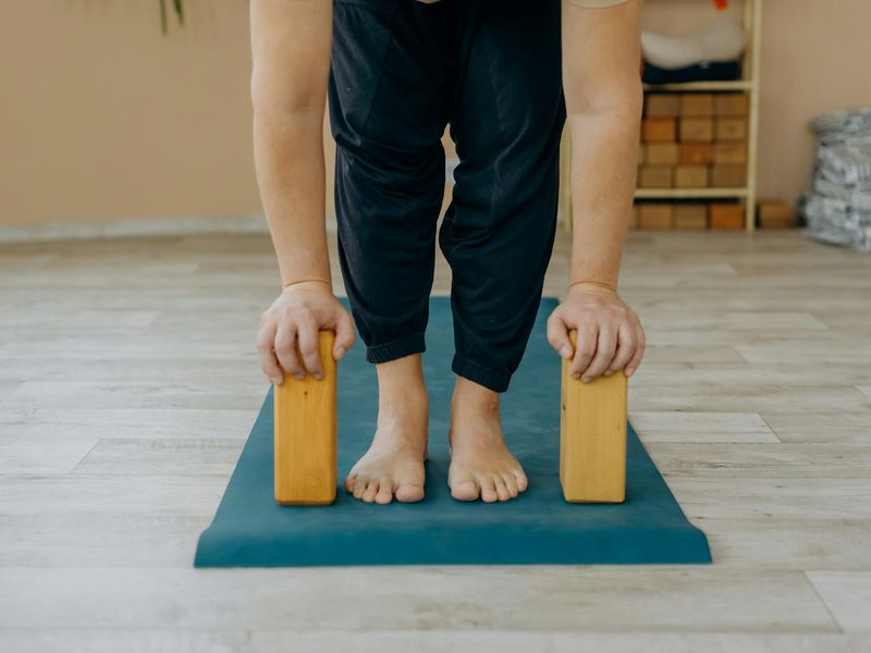 Close up of a yoga mat and weights on floor