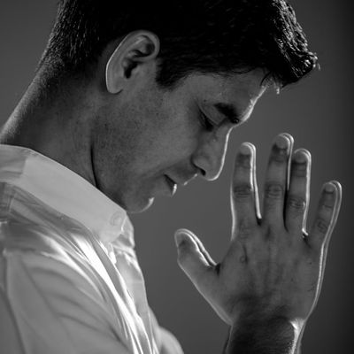 Close up of hands folded in prayer position